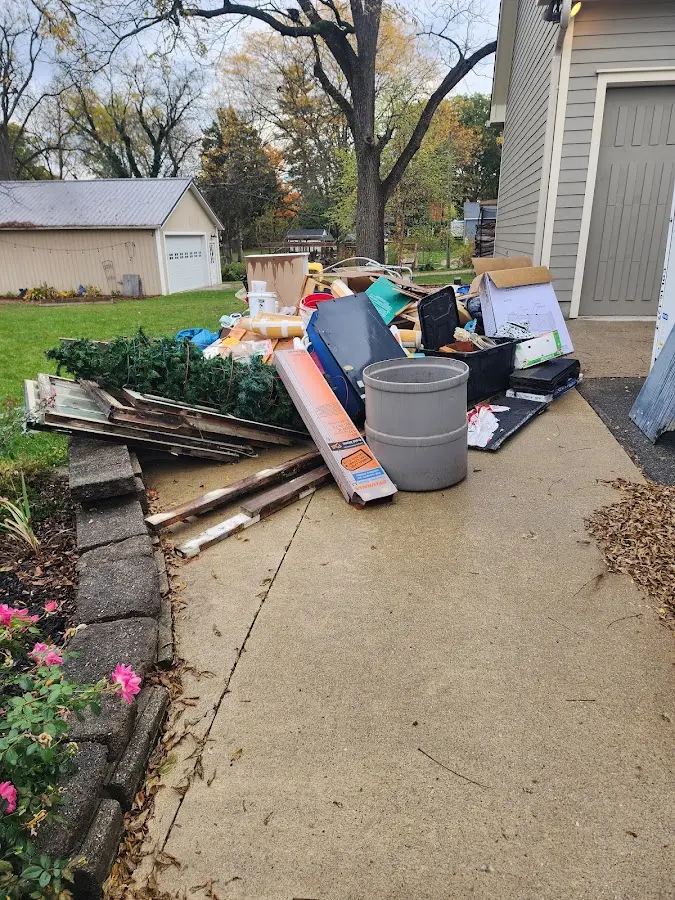 Dumpster being loaded with debris for Demolition Dumpster Rental in Hopatcong